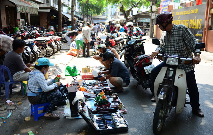 Stalls on the sidewalk and may be spill out into the road.