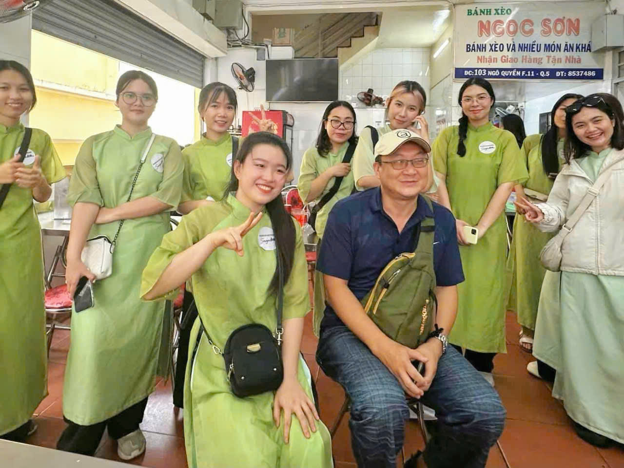Saigon by Night and Street Food on Vespa by Ao Dai Female rider Tour